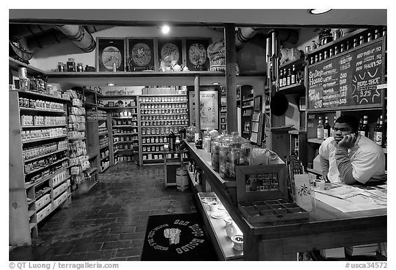 Man at the counter of Tea store,  Old Town. San Diego, California, USA (black and white)