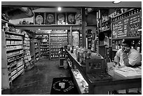Man at the counter of Tea store,  Old Town. San Diego, California, USA (black and white)