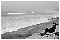 Woman reading on the beach. La Jolla, San Diego, California, USA ( black and white)