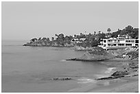 Rocky coastline with waterfront houses at dawn. Laguna Beach, Orange County, California, USA ( black and white)