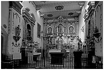 Altar and baroque retablo in the Serra Chapel. San Juan Capistrano, Orange County, California, USA ( black and white)