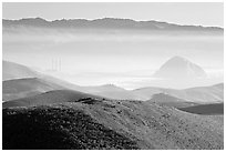 Power plant and Morro Rock seen from hills. California, USA (black and white)