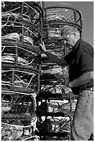 Man loading crab traps. Morro Bay, USA ( black and white)