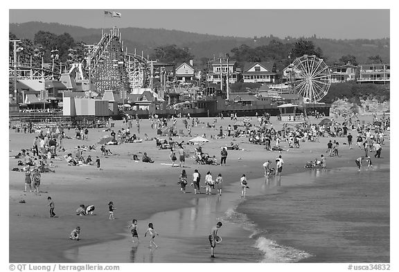 Beach and seaside amusement park on a summer afternoon. Santa Cruz, California, USA (black and white)