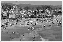 Beach and seaside amusement park on a summer afternoon. Santa Cruz, California, USA (black and white)