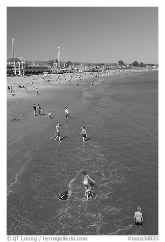 Children playing on the beach. Santa Cruz, California, USA (black and white)