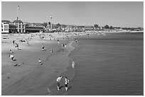 Beach with couple standing in water. Santa Cruz, California, USA ( black and white)