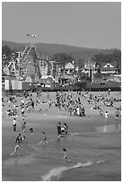 Children, beach, and boardwalk. Santa Cruz, California, USA ( black and white)
