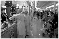 Buddhist nuns in the foot court of the Grand Century mall. San Jose, California, USA ( black and white)