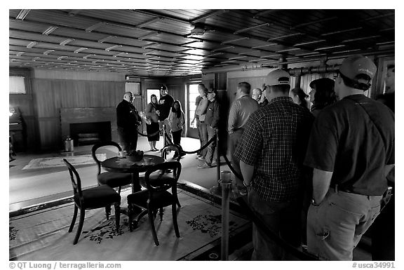 Guided tour. Winchester Mystery House, San Jose, California, USA (black and white)