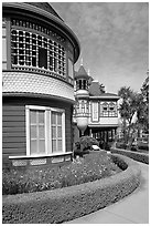 Mansion wing with door to nowhere in the background. Winchester Mystery House, San Jose, California, USA ( black and white)