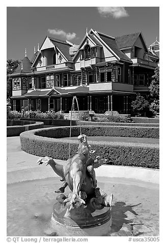 Fountain and mansion. Winchester Mystery House, San Jose, California, USA (black and white)