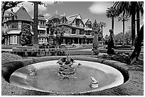Basin, gardens and facade. Winchester Mystery House, San Jose, California, USA (black and white)