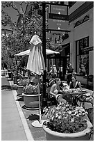 Outdoor restaurant tables. Santana Row, San Jose, California, USA (black and white)