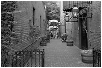Alley with red brick walls, San Pedro Square. San Jose, California, USA ( black and white)