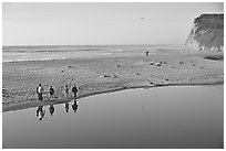 Family walking by lagoon, Scott Creek Beach. California, USA ( black and white)