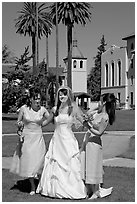 Bride and bridesmaids in front of mission, Santa Clara University. Santa Clara,  California, USA ( black and white)