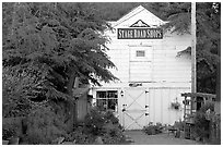 White-facaded store tucked in trees, Pescadero. San Mateo County, California, USA ( black and white)