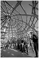 Tour guide and group in the Gazebo of the Watts Towers. Watts, Los Angeles, California, USA ( black and white)