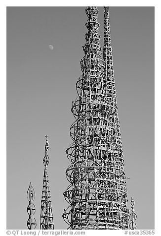 Simon Rodia Watts Towers and moon, late afternoon. Watts, Los Angeles, California, USA