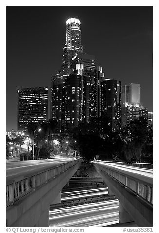Bridge above Harbor Freeway and US Bank building at night. Los Angeles, California, USA