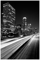 Traffic on Harbor Freeway and skyline at night. Los Angeles, California, USA (black and white)
