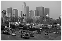 Traffic on freeway and skyline, early morning. Los Angeles, California, USA ( black and white)