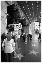 Stars of the Walk of fame in front of the  El Capitan Theatre. Hollywood, Los Angeles, California, USA ( black and white)