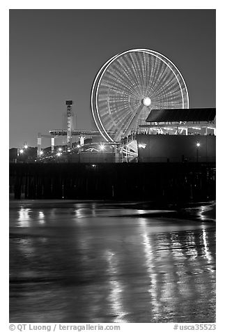 Ferris Wheel in motion at nightfall. Santa Monica, Los Angeles, California, USA (black and white)