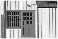 Facade of house with blue doors and windows. Marina Del Rey, Los Angeles, California, USA ( black and white)