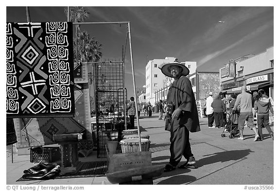 Man selling crafts on Venice Boardwalk. Venice, Los Angeles, California, USA