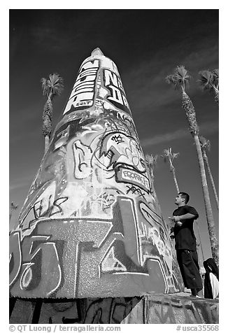 Man creating  graffiti art. Venice, Los Angeles, California, USA (black and white)