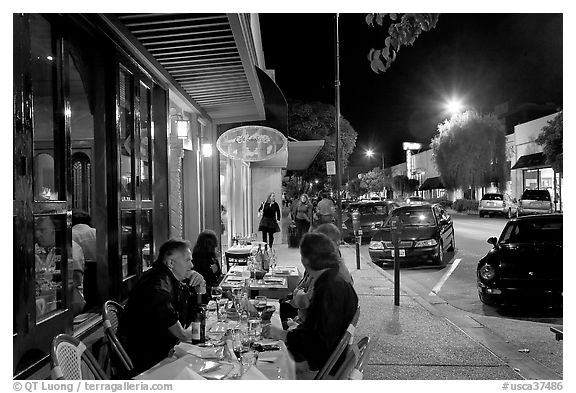 Sidewalk with Outdoor restaurant table and people walking. Burlingame,  California, USA