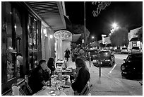 Sidewalk with Outdoor restaurant table and people walking. Burlingame,  California, USA ( black and white)