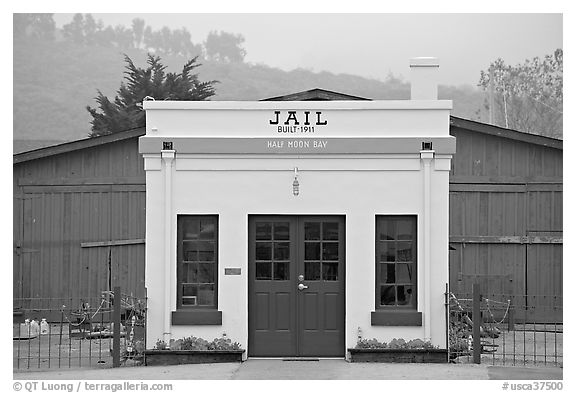 Tiny historic jail. Half Moon Bay, California, USA (black and white)