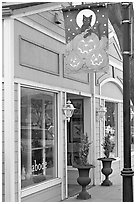 Storefront on Main Street with Halloween street decor. Half Moon Bay, California, USA (black and white)