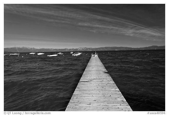 Dock, small boats, and blue waters and mountains, Lake Tahoe, California. USA (black and white)
