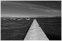 Dock, small boats, and blue waters and mountains, Lake Tahoe, California. USA ( black and white)