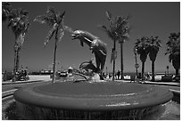 Dolphin fountain and beach. Santa Barbara, California, USA (black and white)