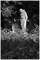 Father Statue and flowers, Mission Dolores garden. San Francisco, California, USA (black and white)