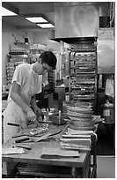 Man preparing pizza, Haight-Ashbury district. San Francisco, California, USA ( black and white)