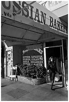 Russian Bakery with redhead woman walking out. San Francisco, California, USA ( black and white)