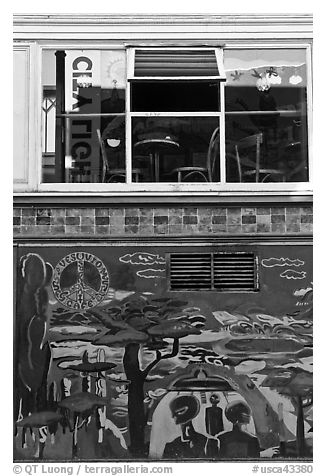 Decor from beatnik period and window reflecting city light sign, North Beach. San Francisco, California, USA (black and white)