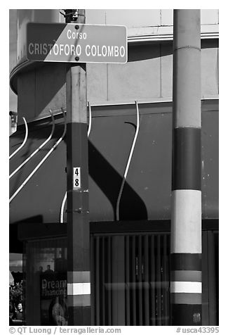 Italian flags painted on lamp posts and name of street in Italian, Little Italy, North Beach. San Francisco, California, USA (black and white)