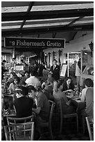 Outdoor terrace of seafood restaurant, Fishermans wharf. San Francisco, California, USA (black and white)
