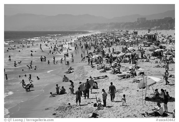 Crowded beach in summer. Santa Monica, Los Angeles, California, USA (black and white)