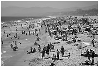Crowded beach in summer. Santa Monica, Los Angeles, California, USA (black and white)