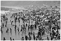 Dense crowds on beach. Santa Monica, Los Angeles, California, USA ( black and white)