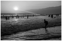 Sunset on beach shore, Santa Monica Beach. Santa Monica, Los Angeles, California, USA ( black and white)