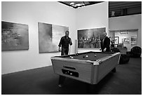 Playing pool inside a contemporary art gallery, Bergamot Station. Santa Monica, Los Angeles, California, USA (black and white)